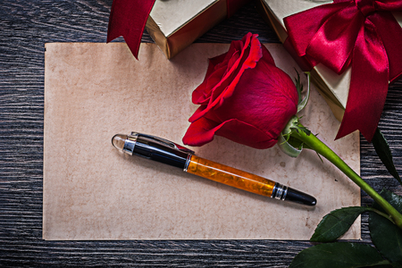 Vintage clean paper red scented rose packed giftboxes fountain pen.の写真素材