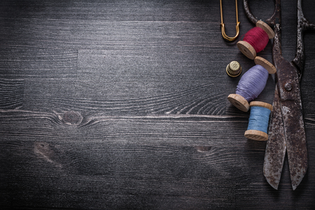 Set of scissors thread spools thimble clasp pin copyspace.の写真素材