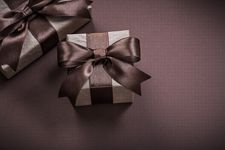Christmas present boxes on brown background holidays concept.の写真素材