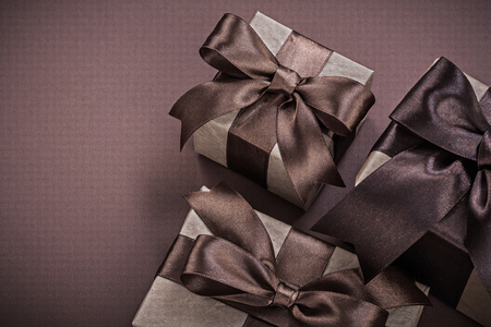 Collection of Christmas present boxes on brown surface holidays concept.