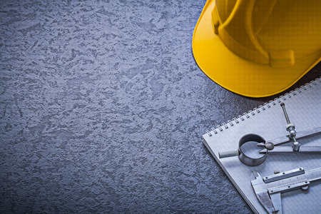 Notebook hard hat divider vernier scale copyspace construction concept.の写真素材