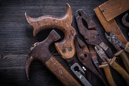Composition of hacksaw nippers pliers tin snips hammer square ruler.の写真素材