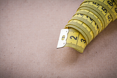 Measuring flexible ruler on vintage background.の写真素材