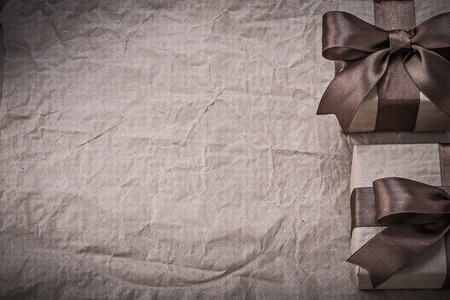 Giftboxes on wrapping paper copy space holidays concept.の写真素材