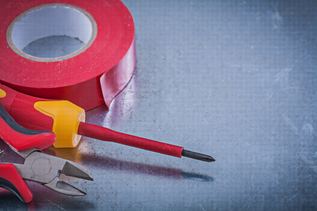 Insulation tape cutting pliers insulated screwdriver construction concept.の写真素材