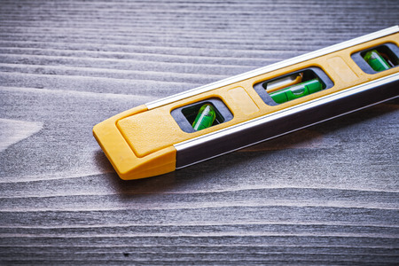 Construction level on vintage wooden board maintenance concept.の写真素材