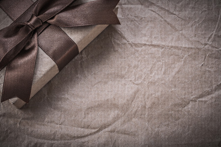 Packed present box on wrapping paper holidays concept.の写真素材