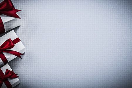Wrapped giftboxes on white surface copy space holidays concept.の写真素材