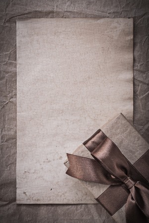 Giftbox with ribbon sheet of wrapping paper holidays concept.の写真素材