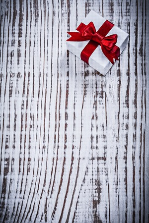 Single present box on vintage wood board holidays concept.の写真素材