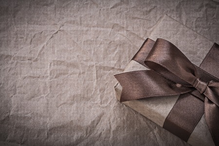 Present box with tape on wrapping paper holidays concept.の写真素材