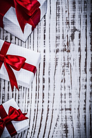 Present boxes on vintage wooden board top view holidays concept.の写真素材
