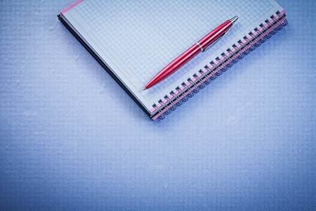 Red pen blank checked copybook office concept.の写真素材