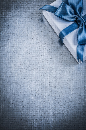 Present box with blue bow on metallic background celebrations concept.の写真素材
