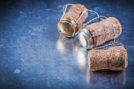 Alcohol cork stoppers with twisted wires on metallic background.の写真素材