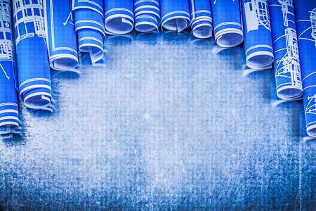 Blue engineering drawings on metallic background construction concept.の写真素材