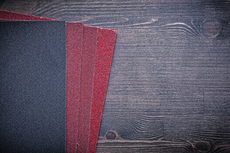 Abrasive paper on vintage wooden board.の写真素材