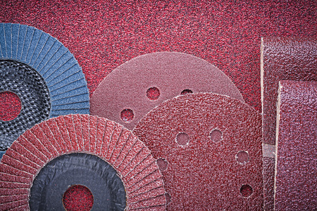 Rolled abrasive paper grinding wheels on polishing sheet.の写真素材