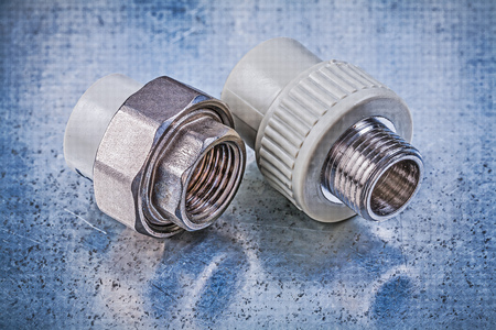 Screw-thread pipe connectors on metallic background construction concept.の写真素材