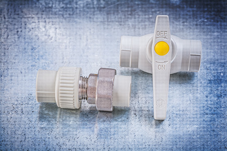 Water valve threaded pipe connectors on metallic surface construction concept.の写真素材