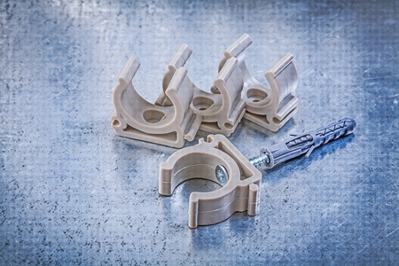 Collection of water pipe fixtures on scratched metallic background construction concept.の写真素材