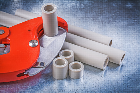 Set of plumbers tools on scratched metallic background construction concept.の写真素材