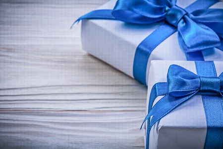 Composition of gift boxes on wooden board celebrations concept.の写真素材