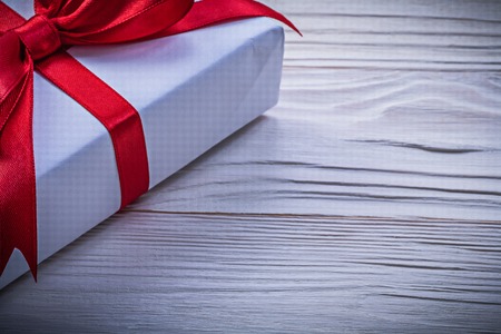 Giftbox with red bow horizontal image holidays concept.の写真素材
