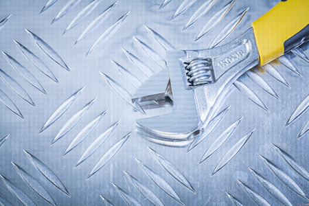 Adjustable spanner on corrugated metal plate construction concept.の写真素材
