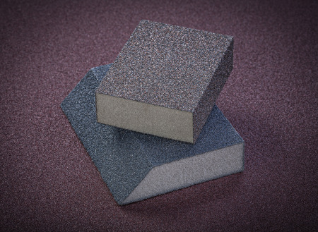 Abrasive sponges on polishing paper top view.の写真素材