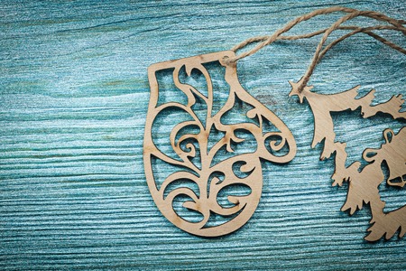 Vintage wooden Christmas tree mitten string on wood board holidays concept.の写真素材