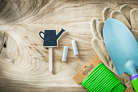 Protective gloves shovel soft wire tie chalkboard price sign tag gardening concept.の写真素材