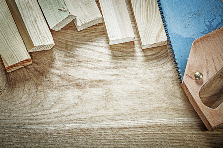 Set of handsaw wooden planks on wood board construction concept.