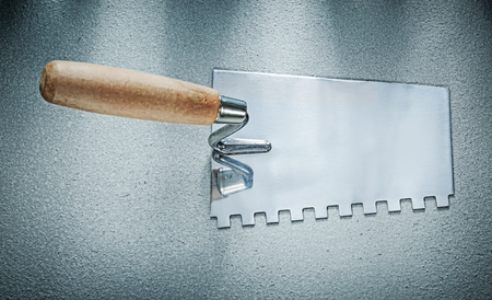 Bricklaying trowel on concrete background construction concept.の写真素材