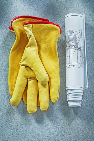 Protective gloves engineering drawings on concrete surface construction concept.の写真素材