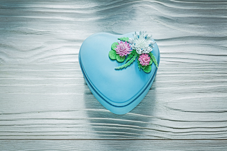 Blue heart-shaped present box on wooden board holidays concept.の写真素材