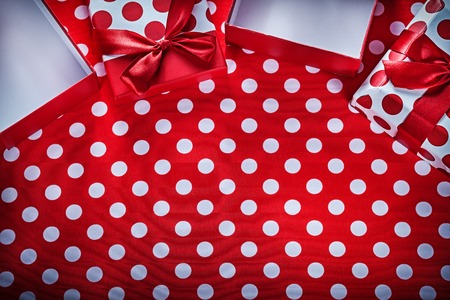 Gift boxes on polka-dot red print background celebrations concept.の写真素材