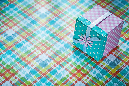 Packed present box on checked textile holidays concept.の写真素材