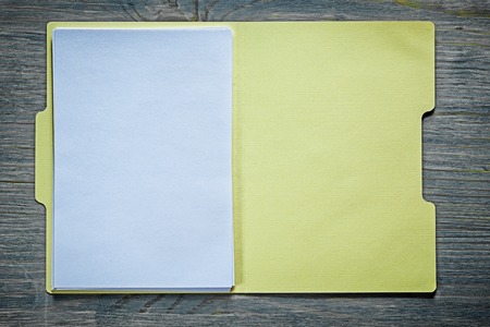 Cardboard office paper folder on wooden board.の写真素材