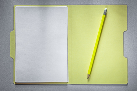 Opened office folder paper pencil on grey background education concept.