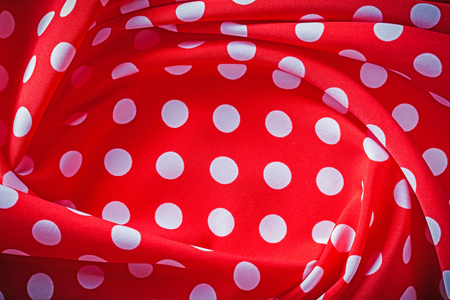 Red polka-dot fabric holidays concept.の写真素材