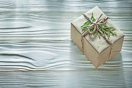 Handmade boxed present with thuya branch top view.の写真素材
