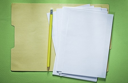 Office folder paper sheets pencil on green background.