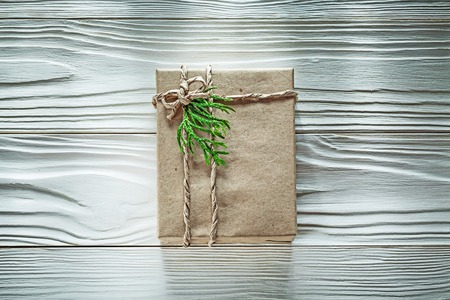 Handmade present box with green thuya branch top view celebrations concept.の写真素材