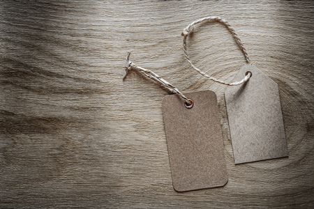 Cardboard price tags on wooden board.の写真素材