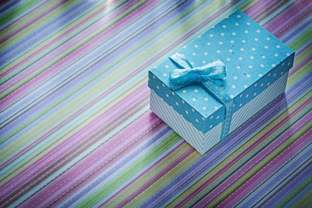 Gift box on striped background directly above celebrations concept.の写真素材