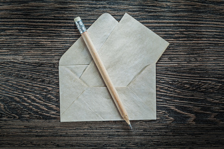 Set of vintage envelope paper pencil on black board.の写真素材