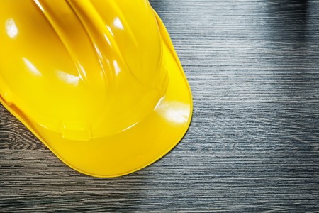 Safety hard hat on wooden board.の写真素材
