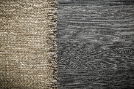 Vintage hessian cloth on wooden board.の写真素材