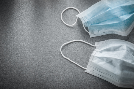 Sterile flu masks on grey background.